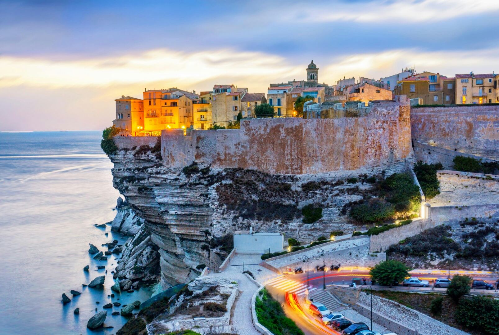 Coastal town on limestone cliffs at twilight
